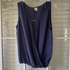 Blue sleeveless top with gold piece in front